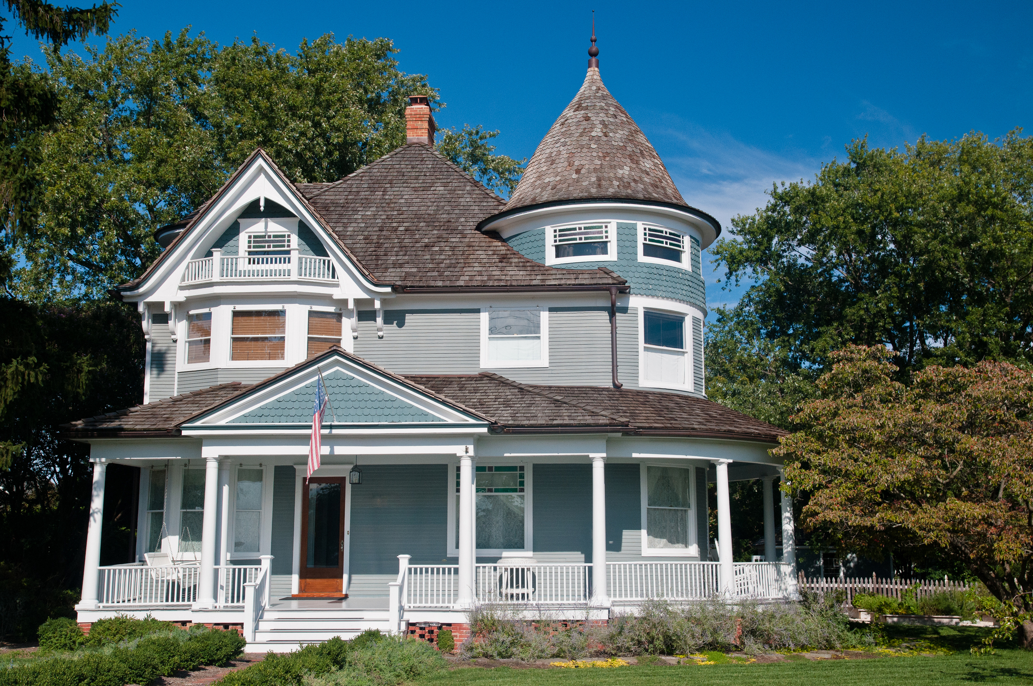 Historic Saline home roofing siding window services, blue home with blue skies