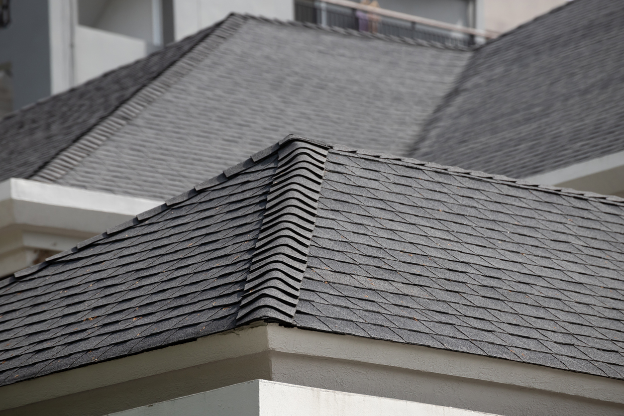 residential roofing services ann arbor, image of expertly done gray shingle roof close up.